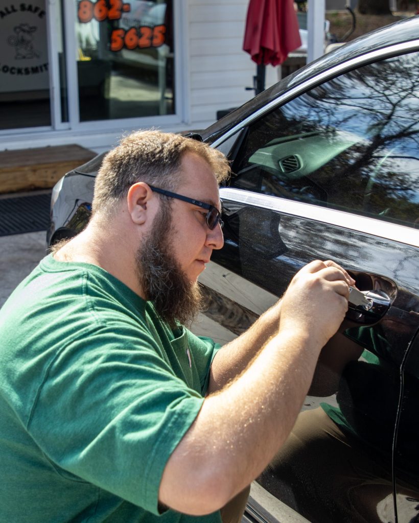 Carmine Jr repairs the lock on a sedan - Locksmith Hudson