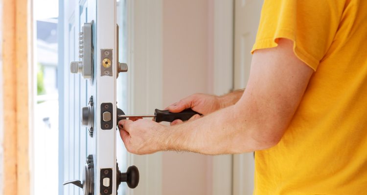 worker-installing-or-repairing-new-lock-handyman-repair-the-door-lock.jpg
